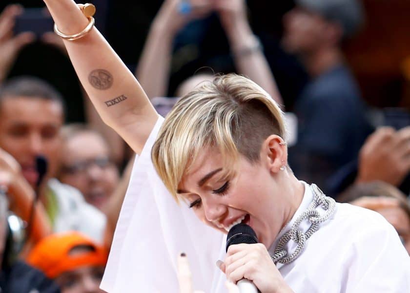 Miley Cyrus’ Tattoos and What They Mean – [2022 Celebrity Ink Guide]